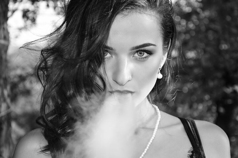 The girl is in the smoke.