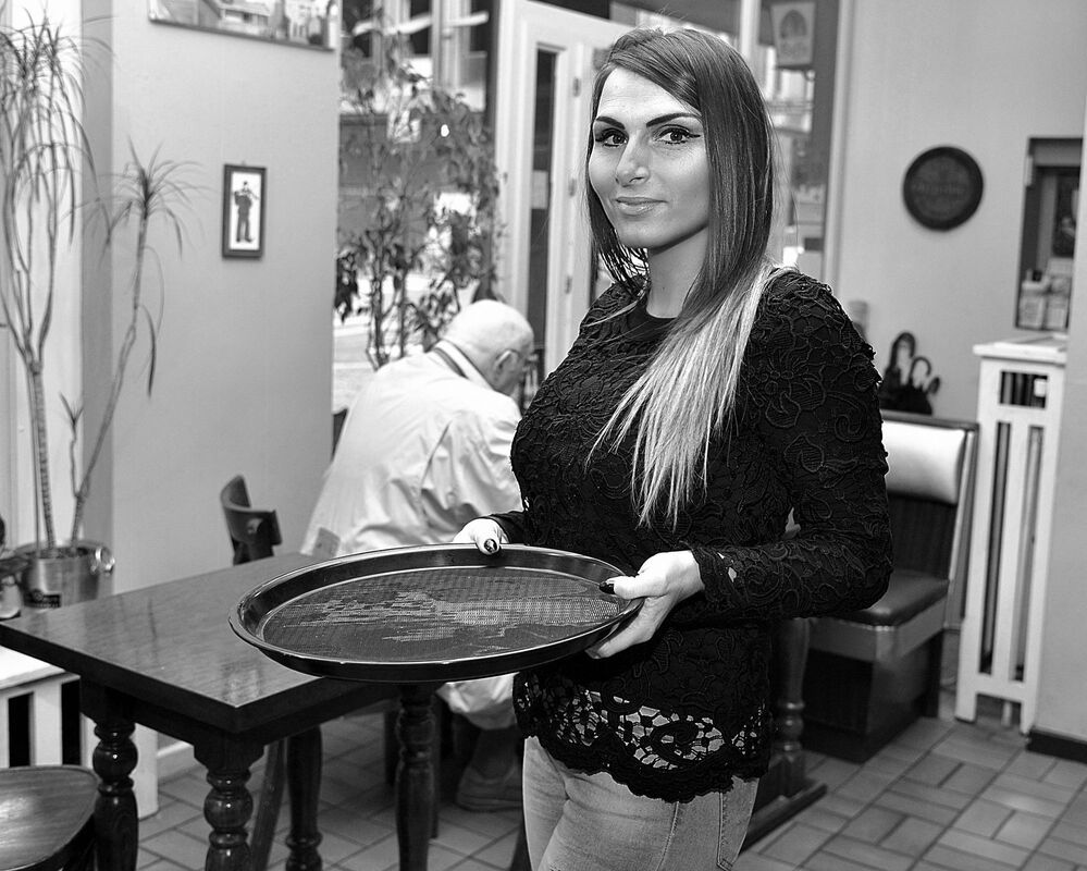 Portraits of bistro owners.