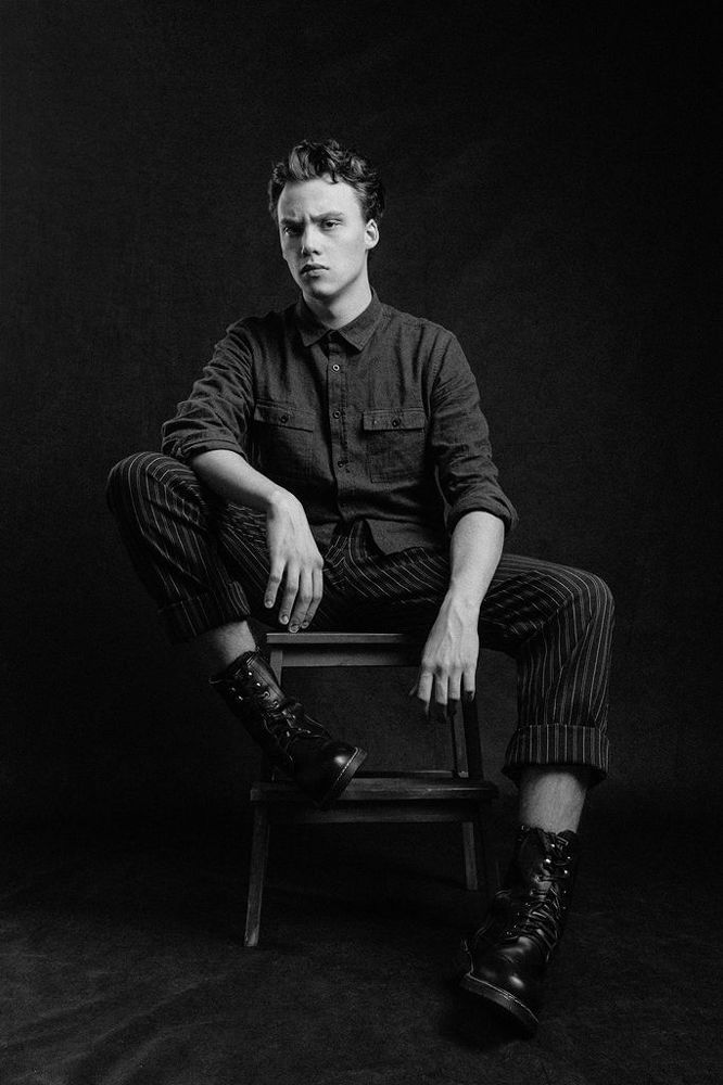 А.