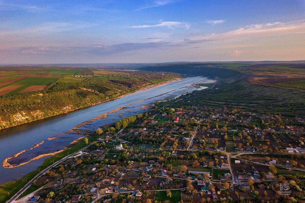 Flight over a little village at springtime