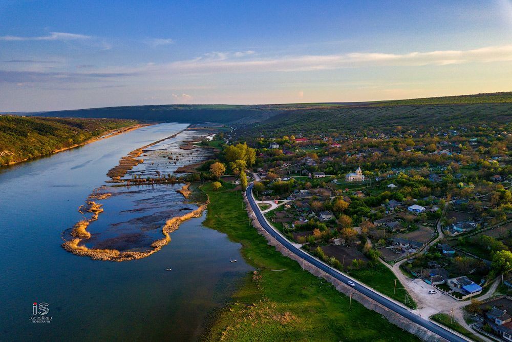 Flight over a little village at springtime