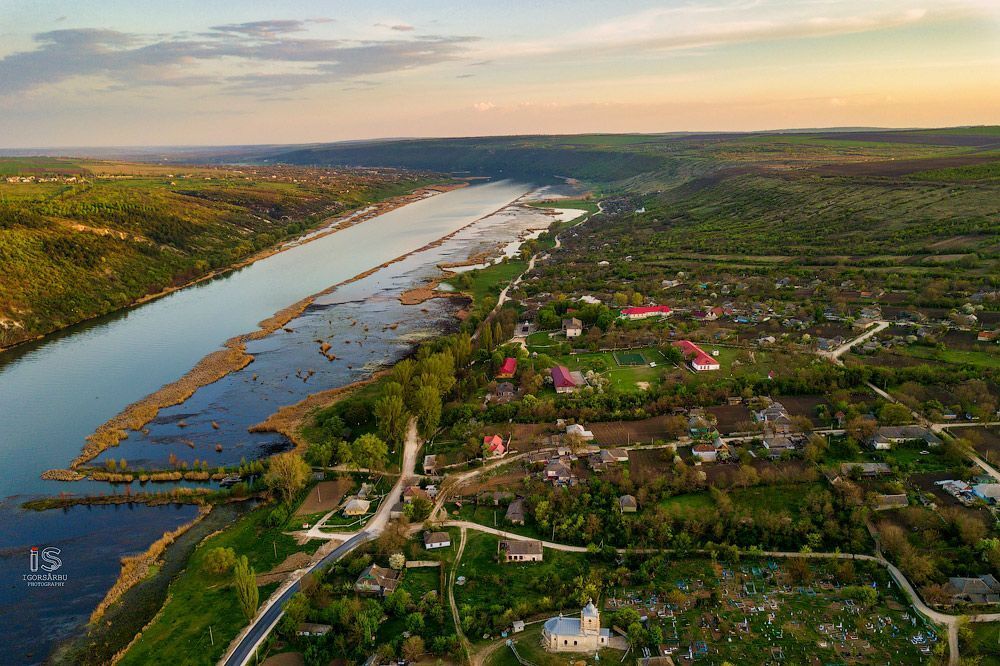 Flight over a little village at springtime