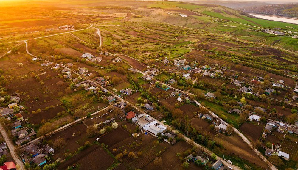 Flight over a little village at springtime