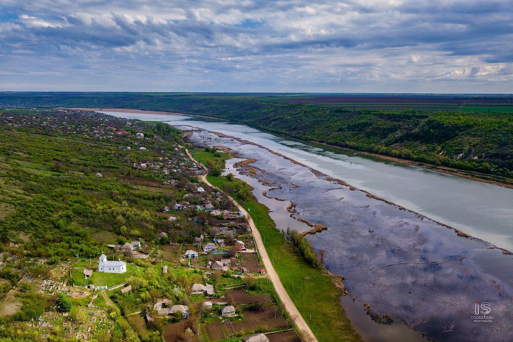 Flight over a little village at springtime