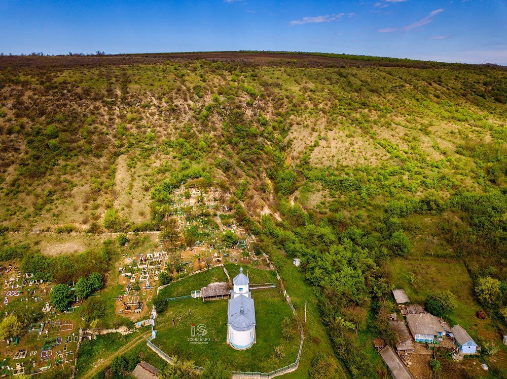Flight over a little village at springtime