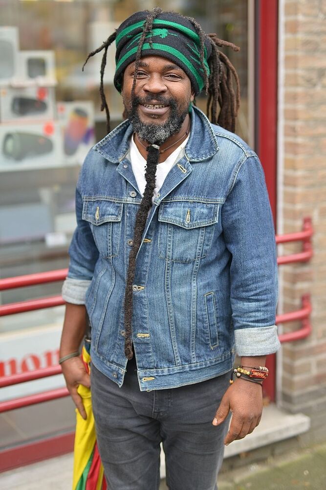 Man from Cameroun with beard 15 years old.