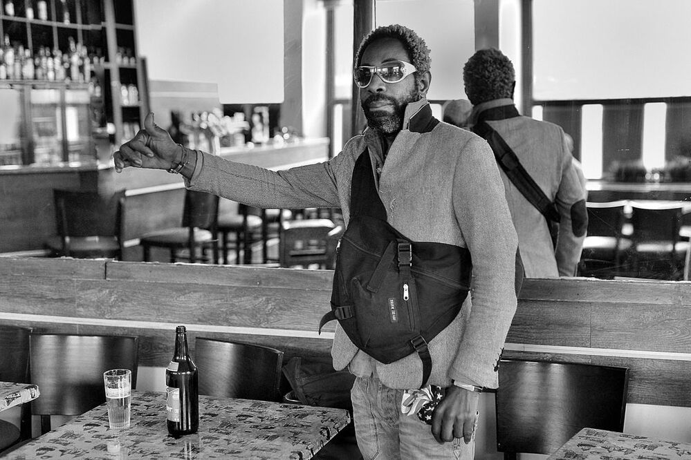 Portraits of bar visitors.