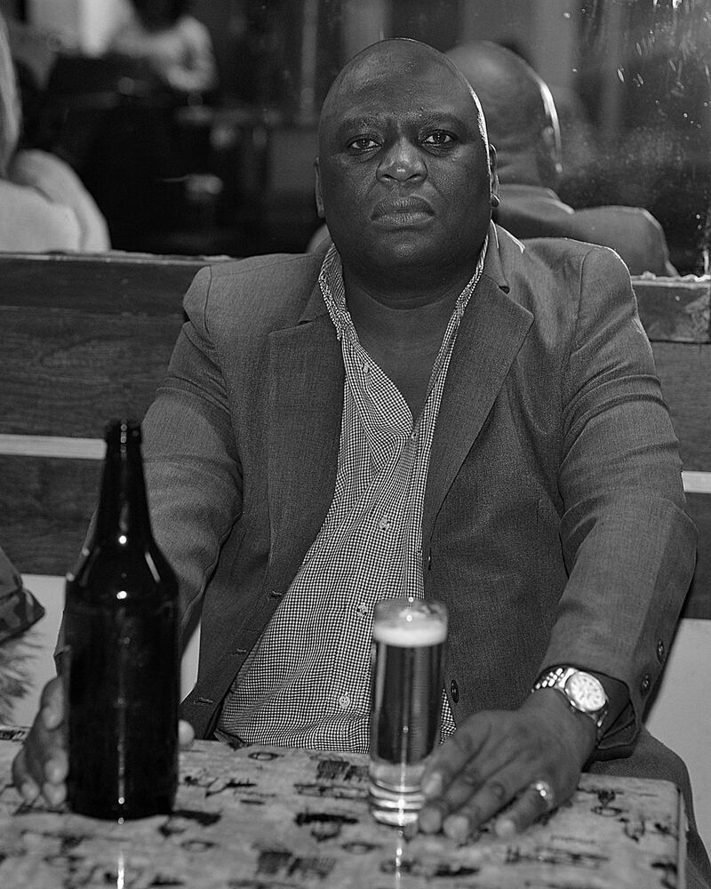Portraits of bar visitors.