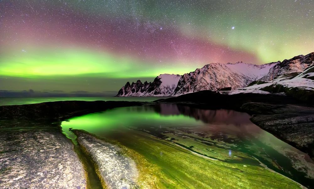Aurora borealis over Ersfjord beach. Senya Island at night, Norway