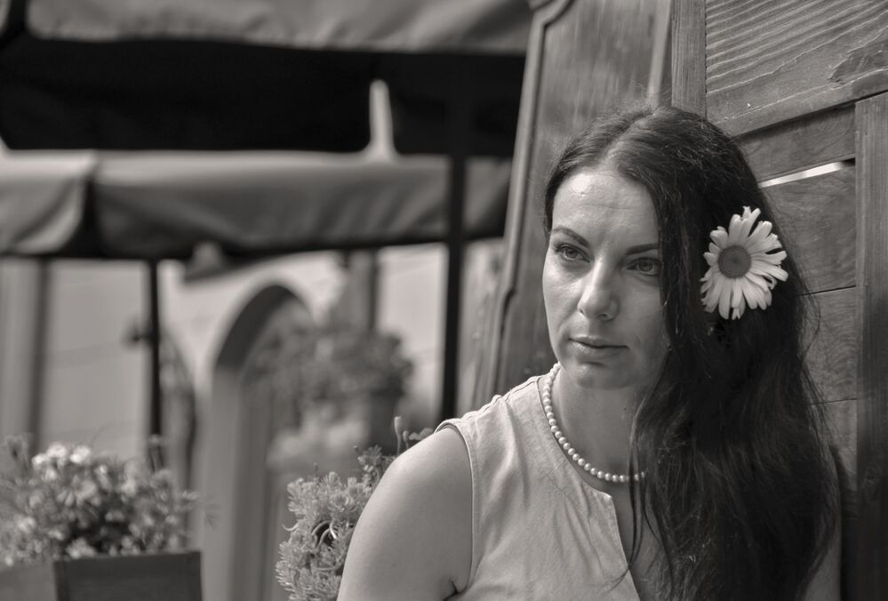 "Woman with a camomile" Woman Portrait. Sepia Version.
