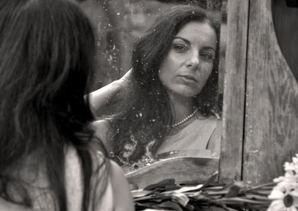 "Woman with a camomile" Woman Portrait. Sepia Version.