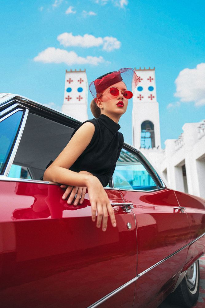 Lady and red Cadillac