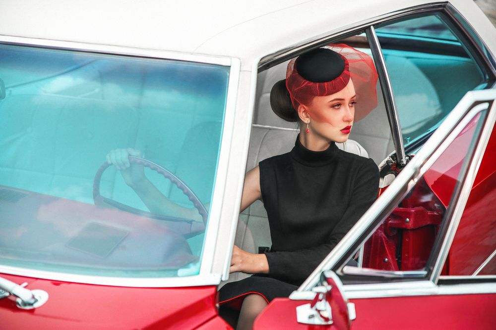 Lady and red Cadillac