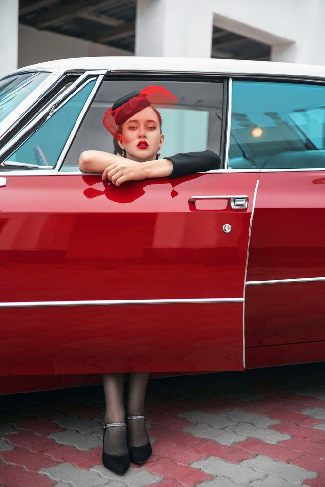 Lady and red Cadillac