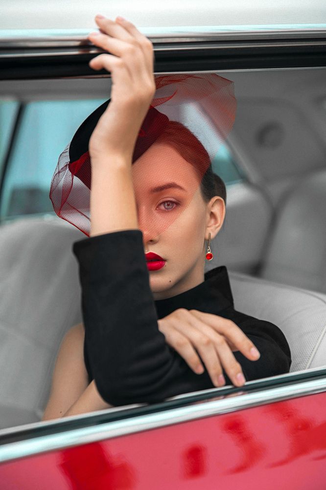 Lady and red Cadillac