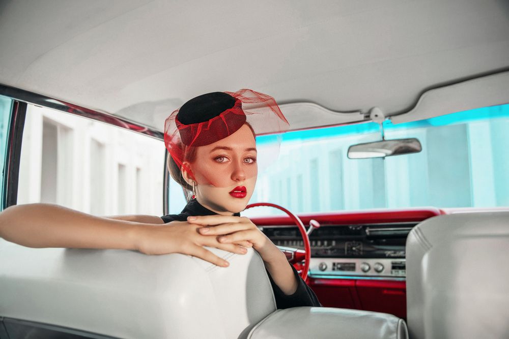 Lady and red Cadillac