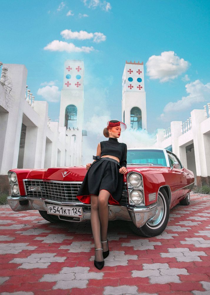 Lady and red Cadillac