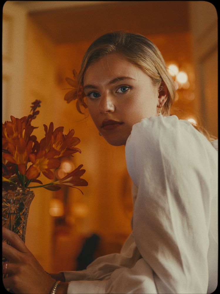 Molly with her beautiful orange flowers