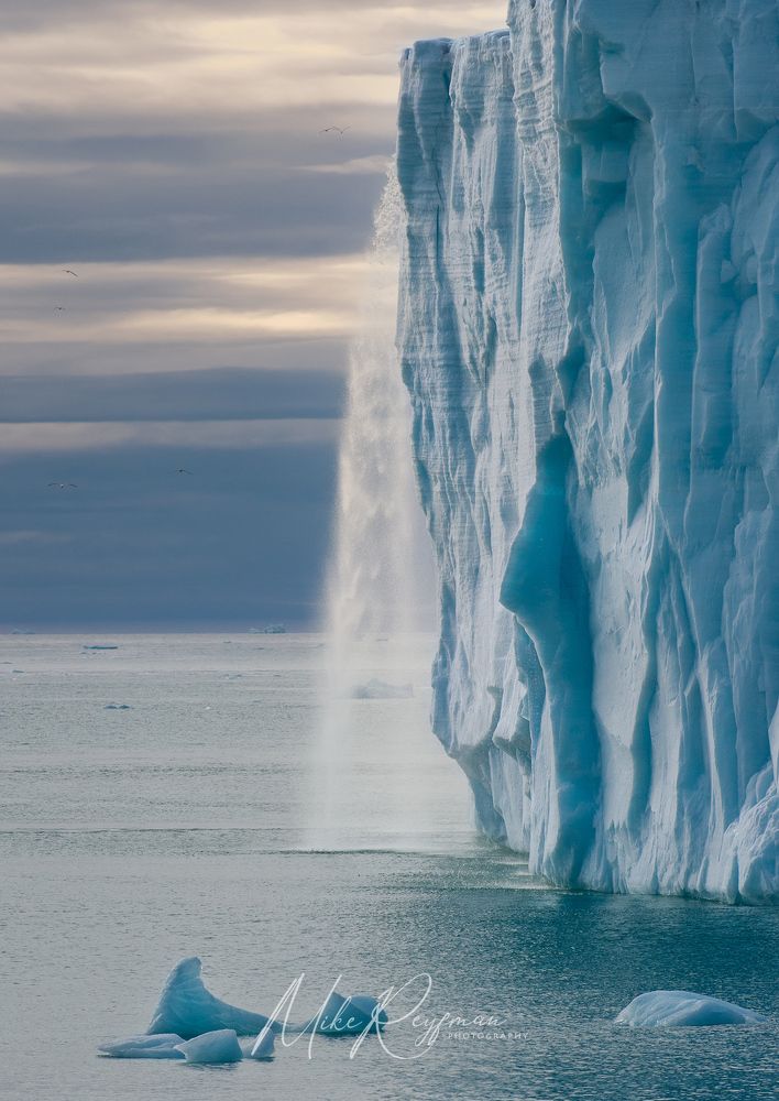 Meltwater waterfall flowing off the Austfonna Ice Cap. Svalbard (Spitsbergen) Archipelago, Norway