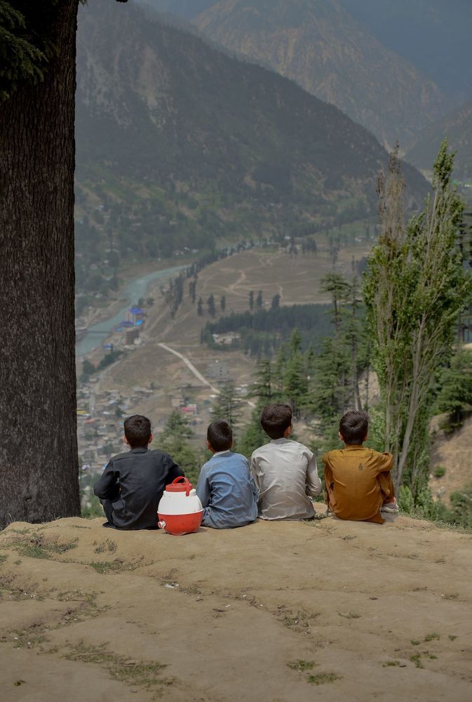 The child in the picture sitting in solitude looking at the beautiful view in front of me and being in thought prompted me to paint it.
The arrival of his friends moments later and the rapid change in the child's mood before their presence gave me the opportunity to create this series.