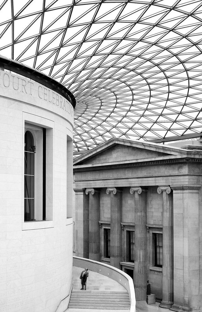 A man admiring the wonderful architecture of the British Museum in London. The museum is a mixture of modern and classic architecture. It really is a beautiful museum with a great collection of old antiquities like the Egyptian Rosetta stone and the famous Greec Elgin marbles.