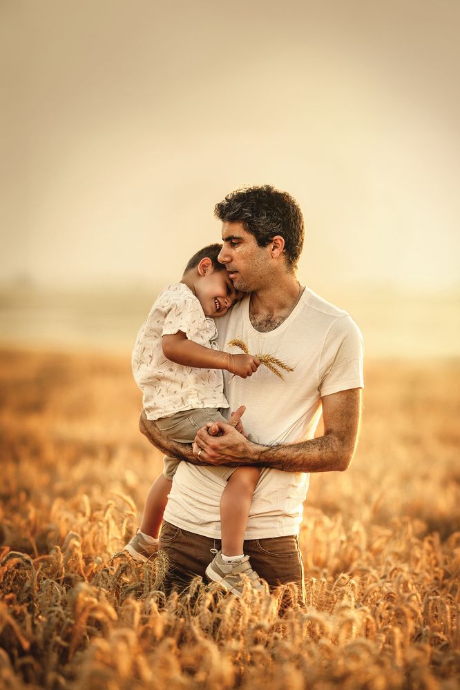 Father and son in a wheat field
