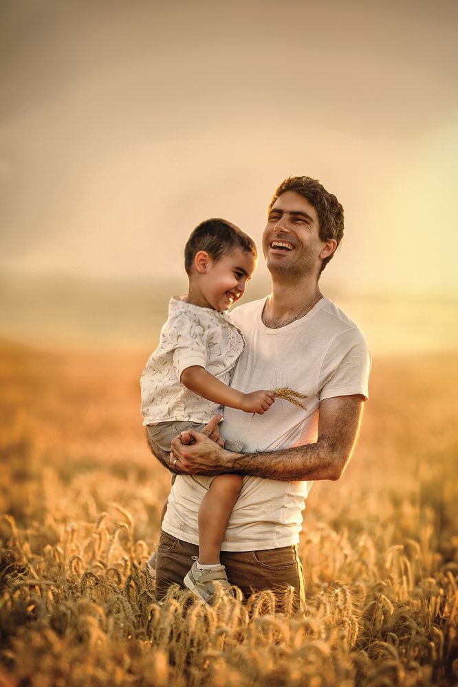 Father and son in a wheat field