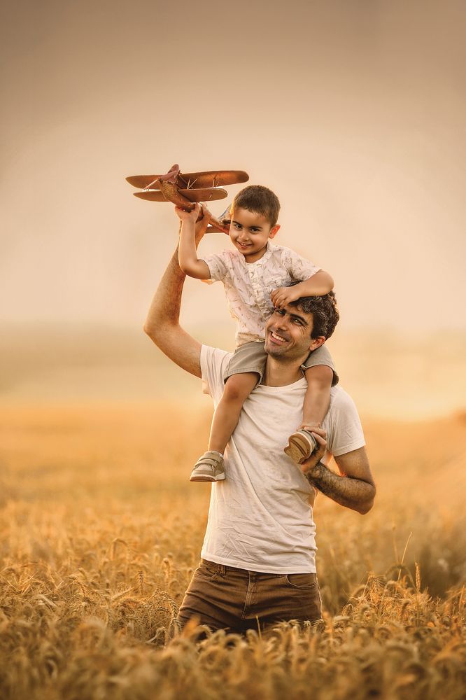 Father and son in a wheat field