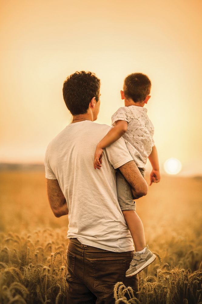 Father and son in a wheat field