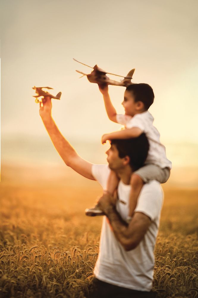 Father and son in a wheat field