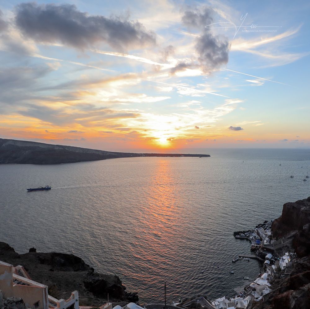 Magnificent sunset view from Oia, Santorini to the Caldera