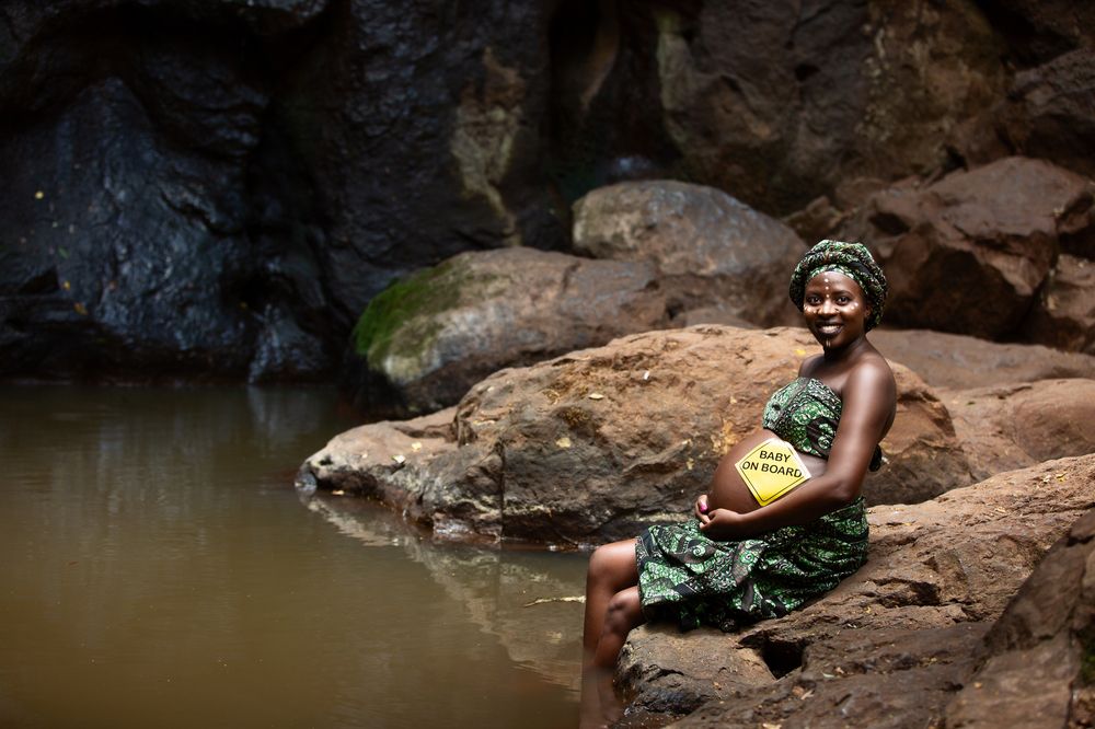 Baby Bump maternity pregnancy outdoors on location waterfalls Karura Forest urban Nairobi City County Kenya East