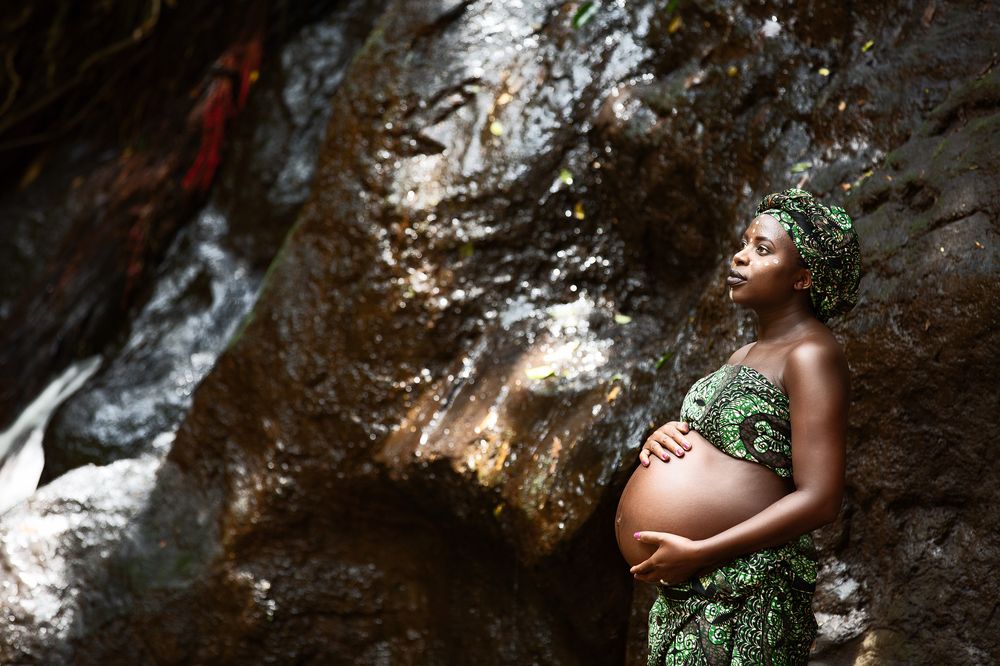 Baby Bump maternity pregnancy outdoors on location waterfalls Karura Forest urban Nairobi City County Kenya East