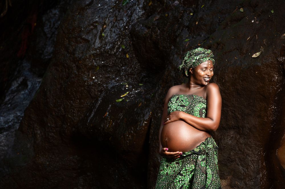 Baby Bump maternity pregnancy outdoors on location waterfalls Karura Forest urban Nairobi City County Kenya East