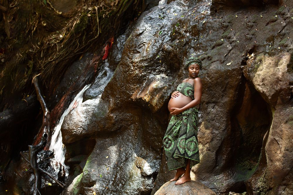 Baby Bump maternity pregnancy outdoors on location waterfalls Karura Forest urban Nairobi City County Kenya East