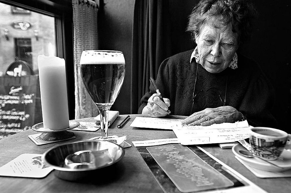 Writing a letter to her son.