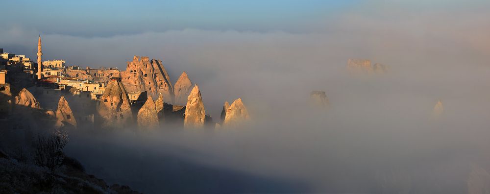 край