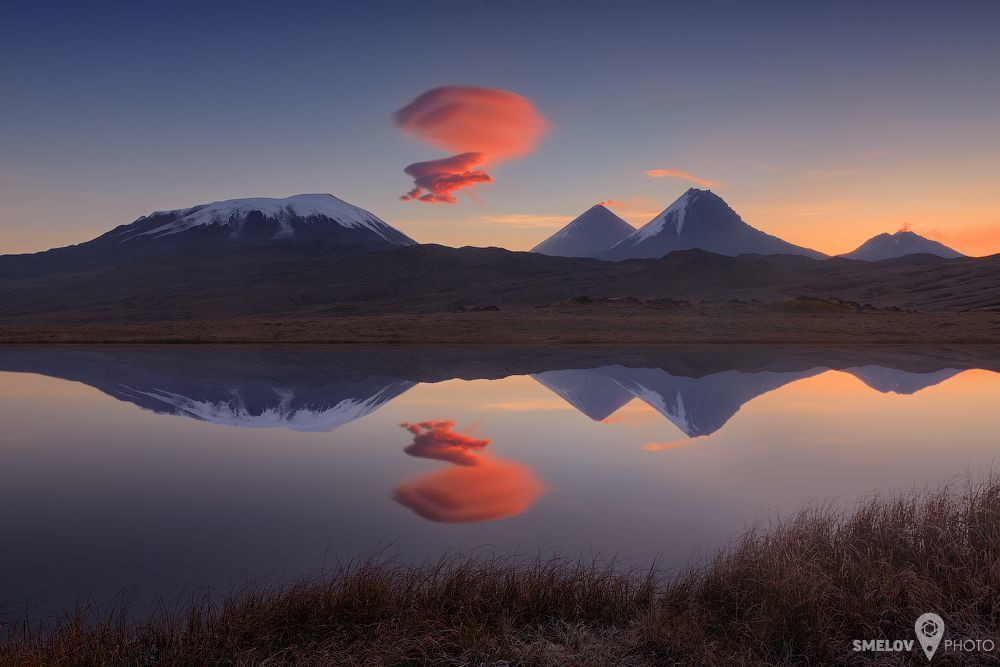 Kamchatka, Russian Federation. From left to right: Ushkovskiy volcano (3943 м), Kluchevskoy volcano (4835 м), Kamen (Stone) volcano (4585 м), Bezimyanniy (NoName) volcano (2882 м).