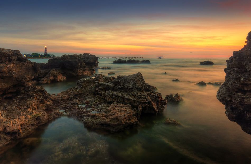 The Sunrise And Old Lighthouse