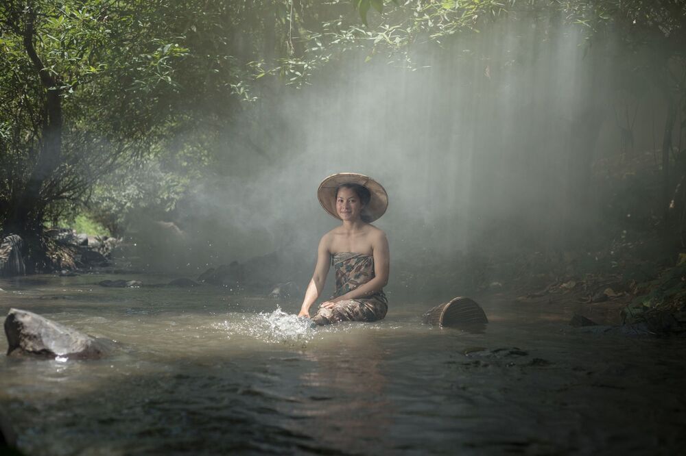 Girl washing on stream