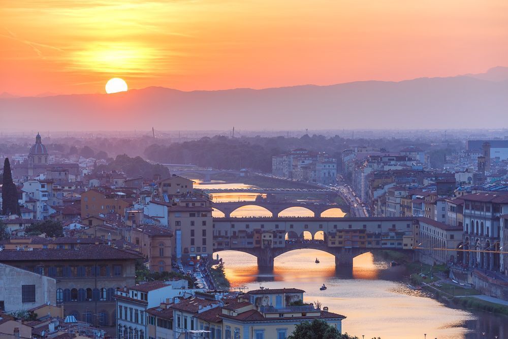 River Arno and famous bridge Ponte Vecchio at sunset from Piazzale Michelangelo in Florence, Tuscany, Italy