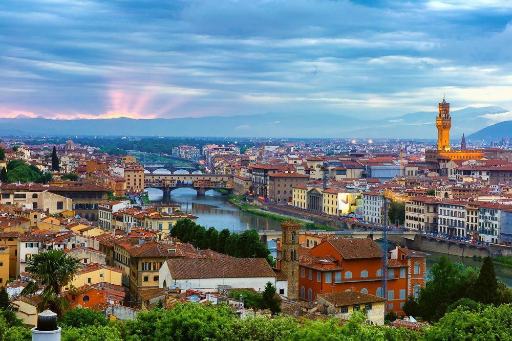 River Arno with bridge Ponte Vecchio and Palazzo Vecchio at sunset from Piazzale Michelangelo in Florence, Tuscany, Italy