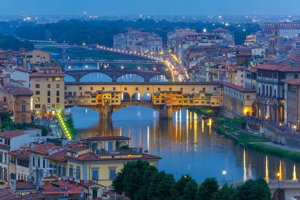 River Arno and famous bridge Ponte Vecchio at twilight from Piazzale Michelangelo in Florence, Tuscany, Italy