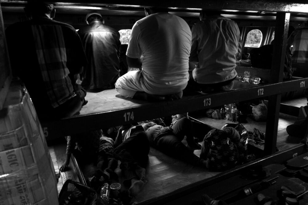 Travelers pray in a ship