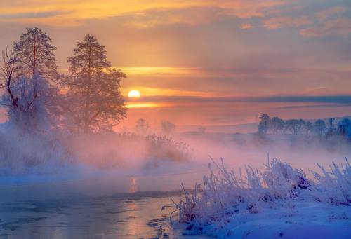 Winter landscape at sunrise