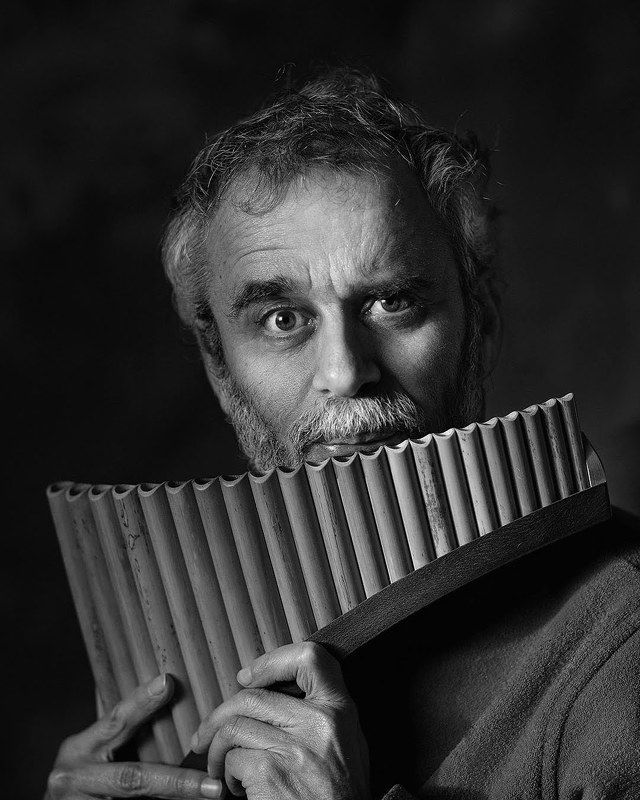 music, musician, pan flute, flutist, wind instrument, wooden musical instrument, man, black, people, dark, guy, face, men, one, beautiful, studio, serious, facial expression portrait with pan\'s flute фото превью