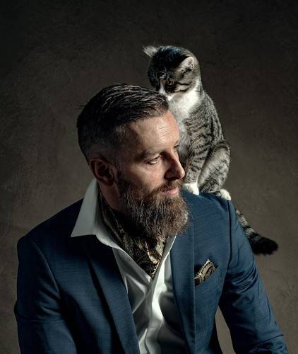 portrait of a man with a cat