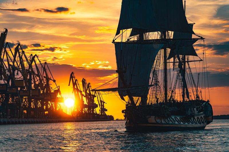 frigate, sea, sail, transportation, boat, ship, cruise, vessel, sailboat, historic, nautical, navigation, water, wooden, voyage, vintage, tall, sky, old, navy, wind, travel, maritime, galleon, transport, ancient, adventure, yacht, wave, marine, mast, anti The Frigate Shtandar in calm weather sailing sunset time Riga Latvia фото превью