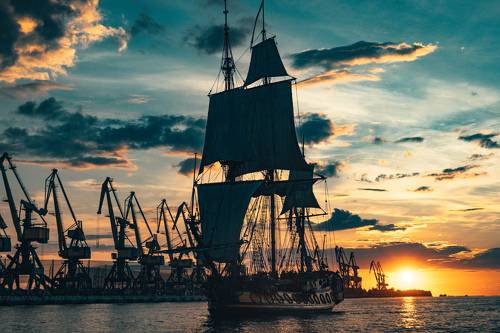 The Frigate Shtandar in calm weather sailing sunset time Riga Latvia