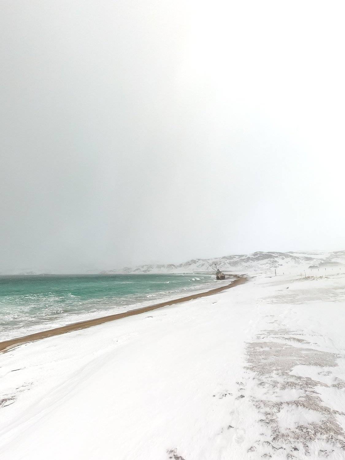 outdoor; snowy; frozen; snow cover; fishing village; peninsula; seascape; arctic circle; coastline; view; horizon; cloudy; tundra; shore; barents sea; clouds; kola peninsula; natural landscape; cloud; no people; kola; murmansk; tropical; north; teriberka;, Dmitry Leonov